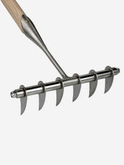 Sneeboer Scarifying Rake 6T with sturdy metal tines for aerating and loosening soil in gardening tasks.