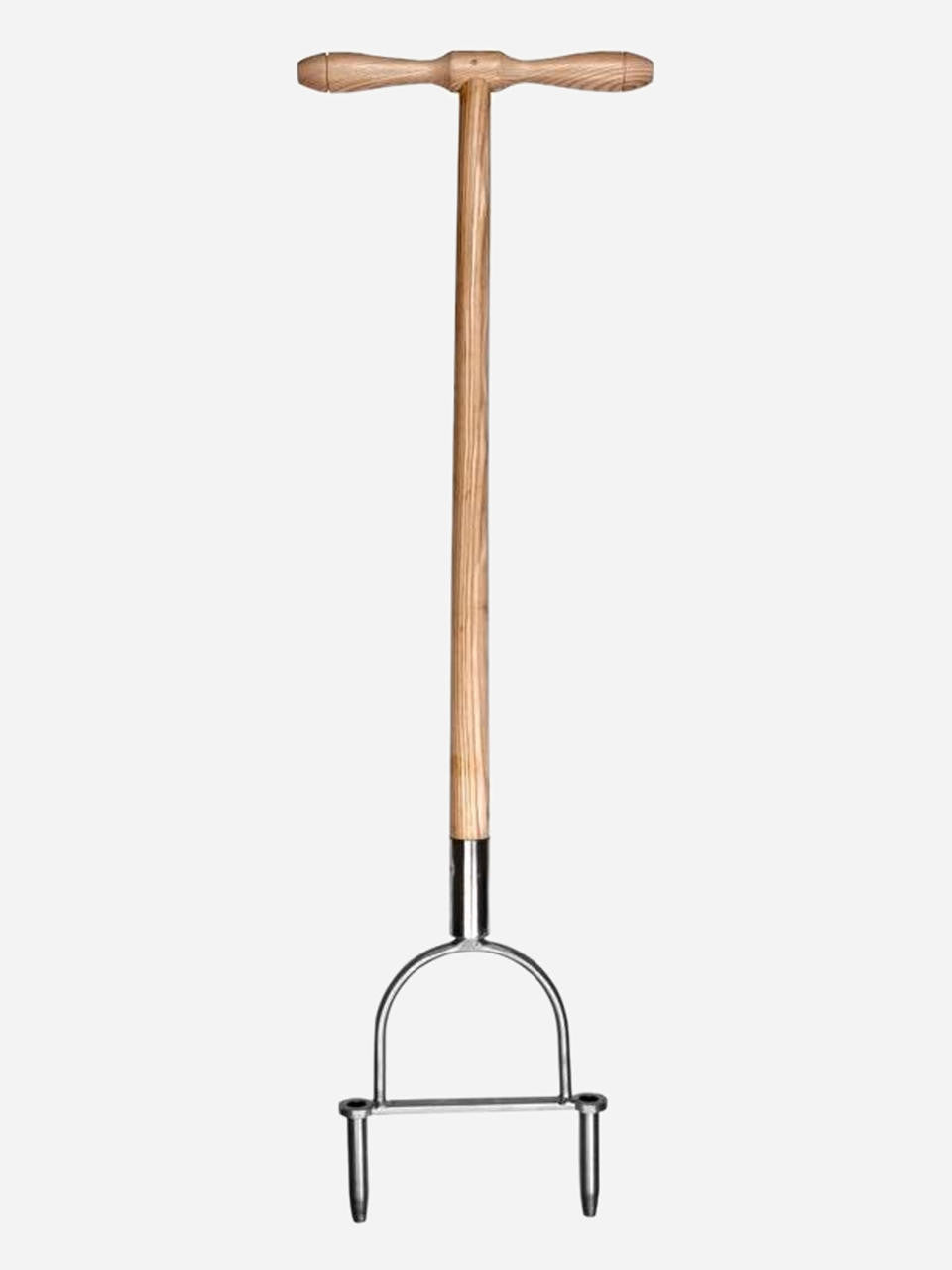Sneeboer lawn aerator, hand tool with metal tines for aerating and improving soil health in gardens.