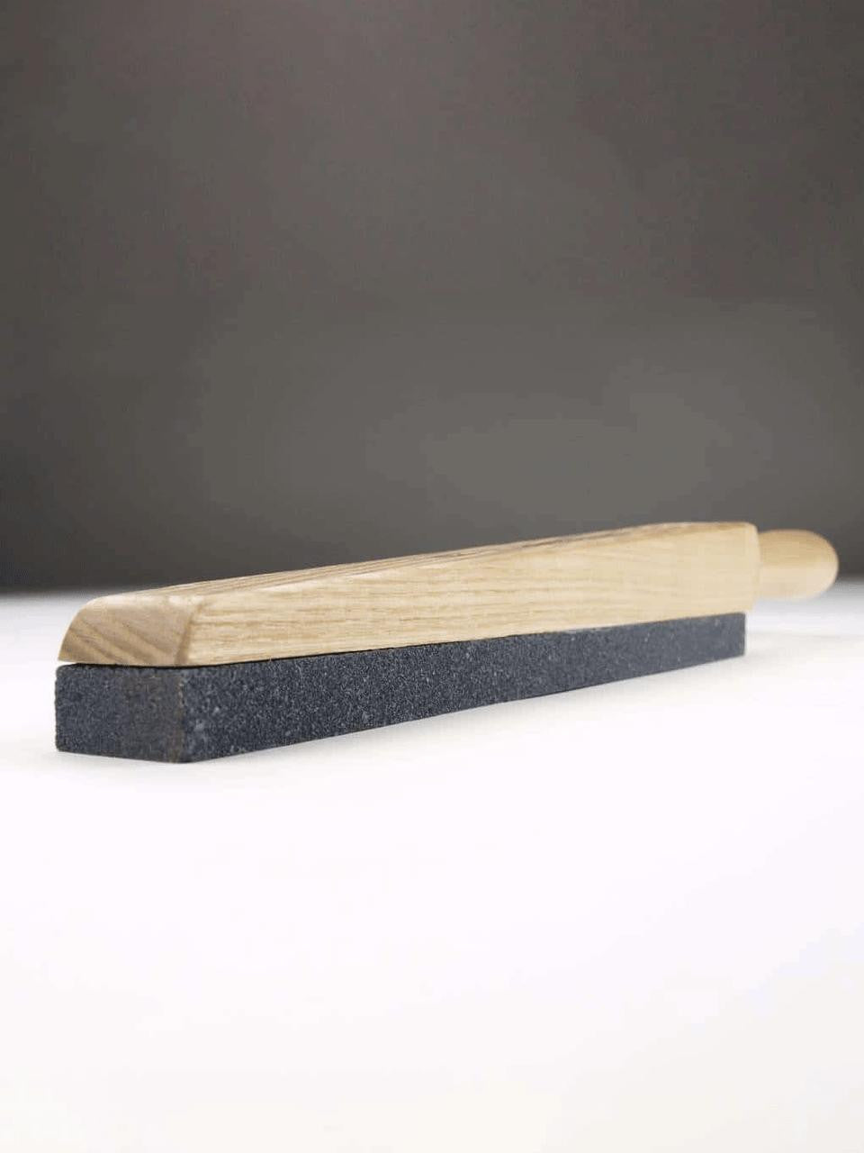 Sneeboer tool sharpener with a compact design, featuring a durable handle and sharpening slot for precise blade maintenance.