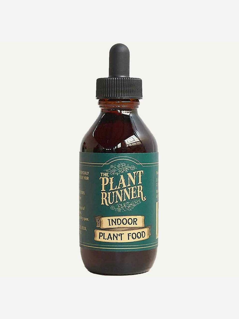 Indoor plant food by The Plant Runner, with a bottle of liquid fertilizer for Indoor plants, showing the product label and packaging.