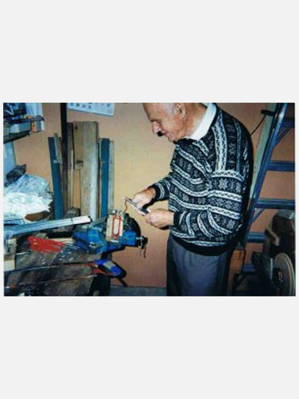 Wonder Weeder garden tool with ergonomic handle and metal prongs for weeding and soil cultivation.
